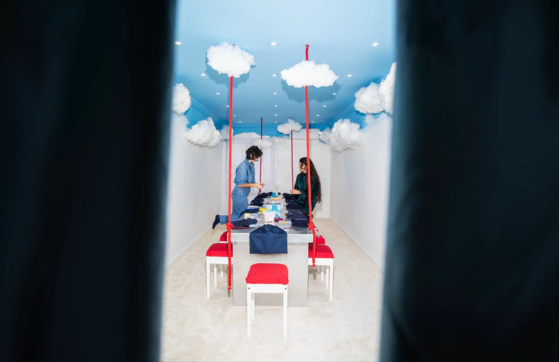 The Cloud Room at Cherry PaoPao in Brussels: a private room with clouds on the ceiling and a long table for group jewelry workshops