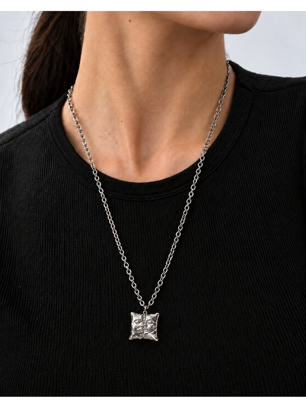 Love Pillow Silver Necklace – complete necklace worn by a model